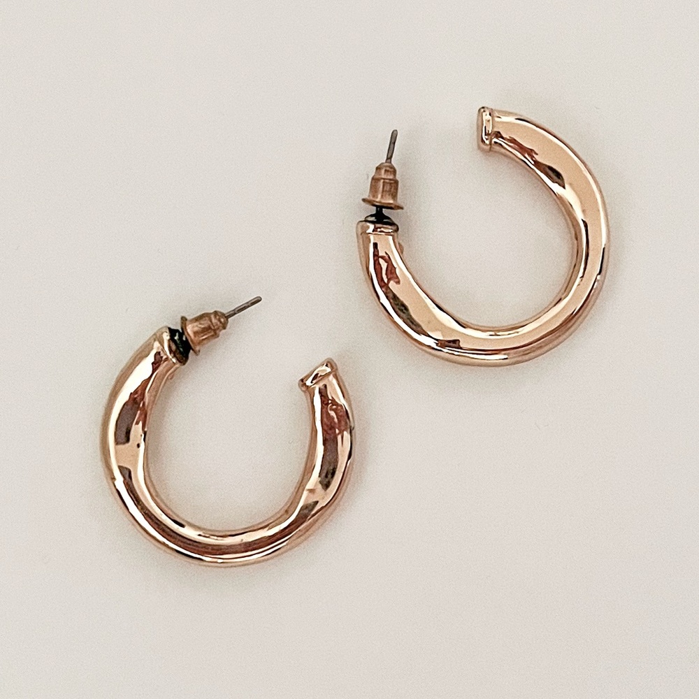 Set of 3 gold hoop earrings.